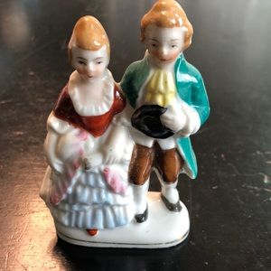 Japan made colonial couple. Most likely from 1950s. 4in tall